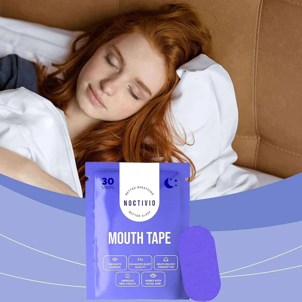 Person lying in bed with a package of Mouth Tape in the foreground